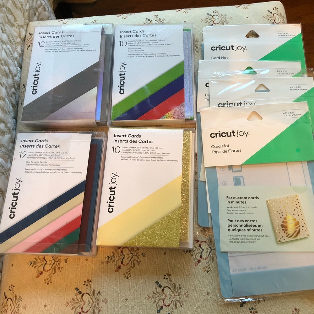 4 boxes of Cricut Joy Insert Cards and 4 Cricut Card Mats.